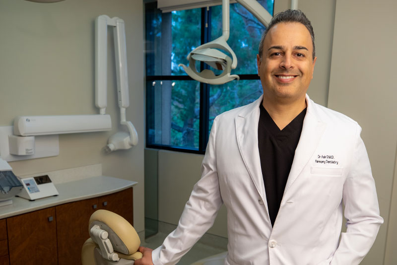 Dr Ashkan Haeri Posing In A Surgical Suite In Harmony Dentistry