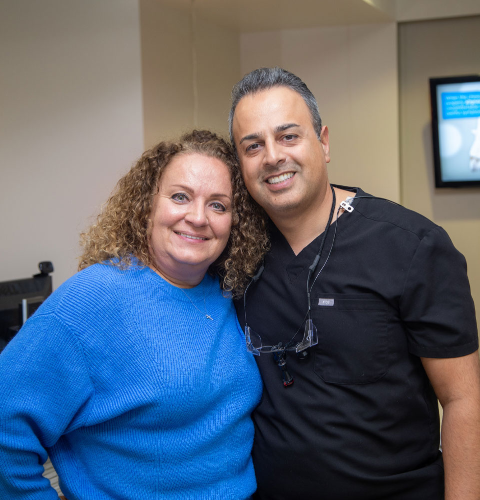 dr haeri and dental patient smiling