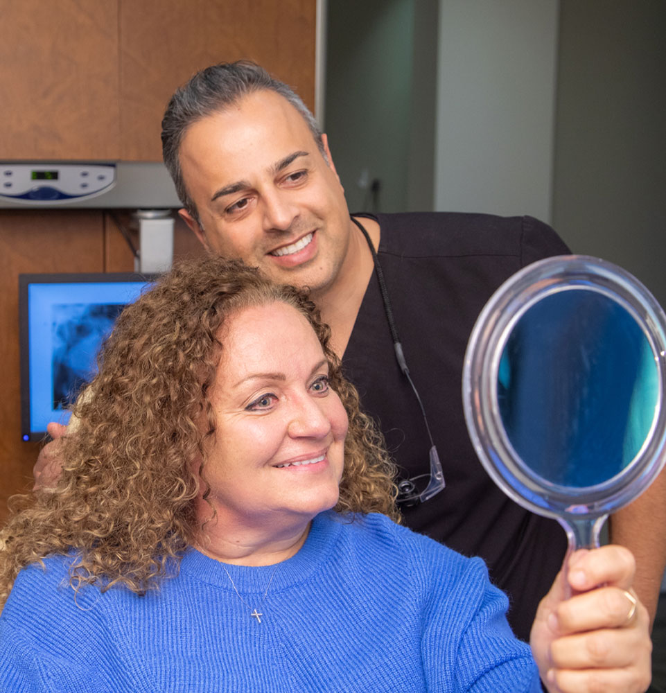 dr haeri and dental patient smiling