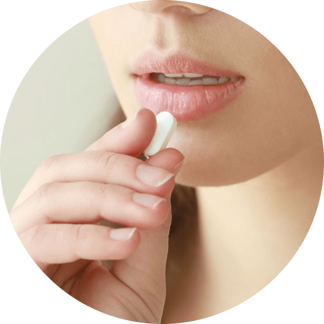 a woman about to take a sedative pill before her oral surgery