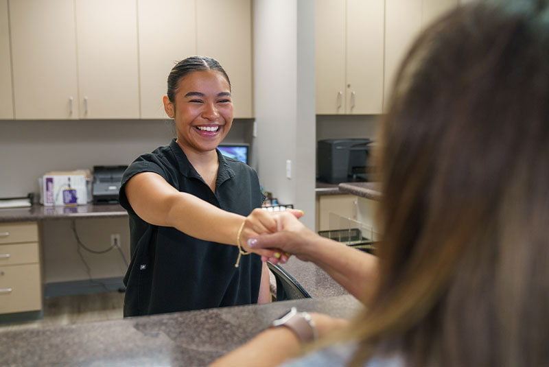 staff member smiling at patient